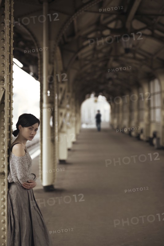 Portrait of serious Caucasian woman at train station