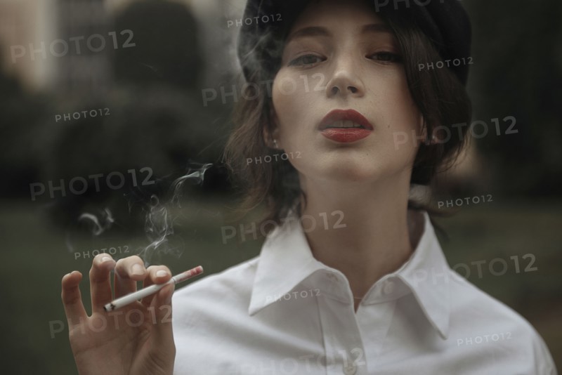 Caucasian woman smoking cigarette