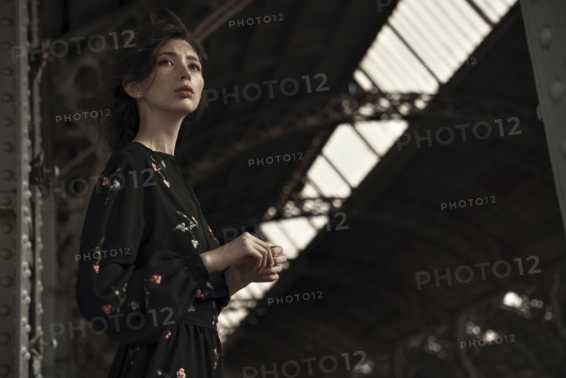 Caucasian woman waiting at train station