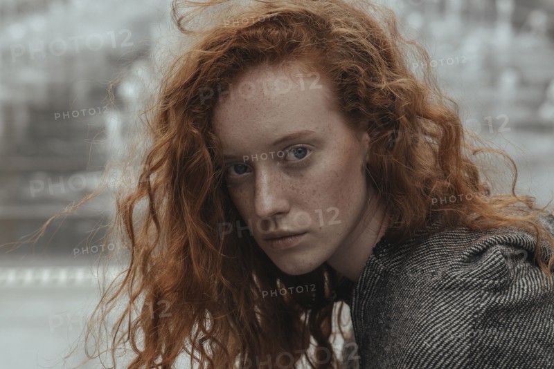 Portrait of serious Caucasian woman with red hair