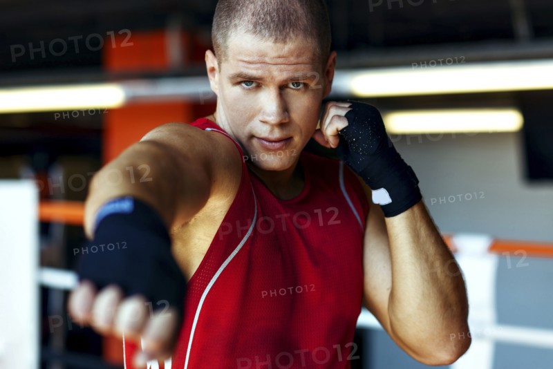 Portrait of Caucasian boxer punching