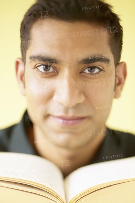 Portrait of man reading book