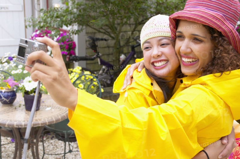 Mother and daughter taking picture
