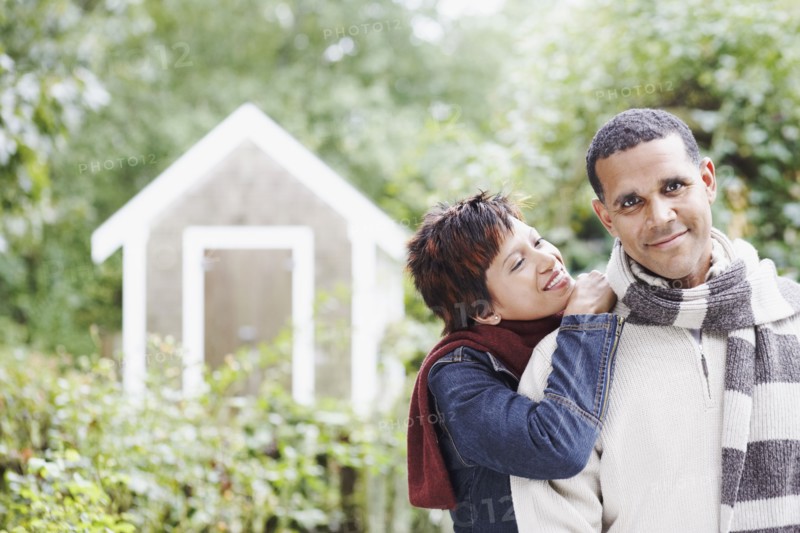 Young couple hugging outdoors