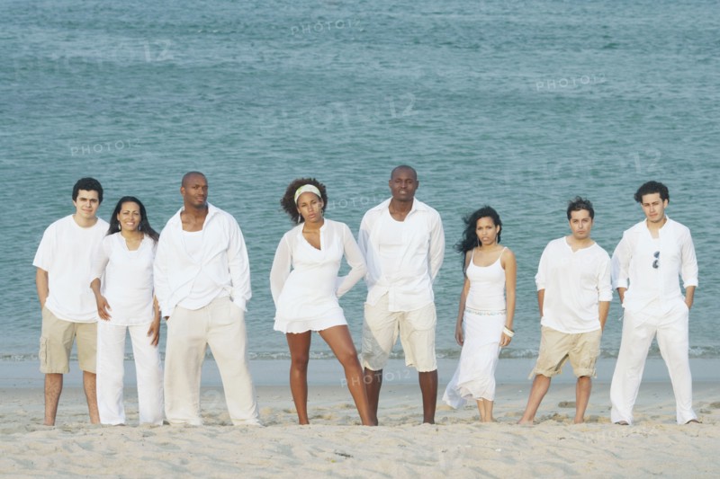 Friends posing for the camera on the beach