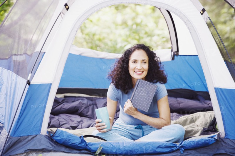 Woman with coffee in tent