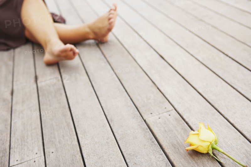 Woman and flower on deck