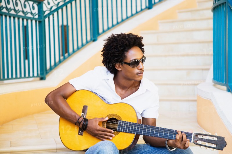 African man playing guitar