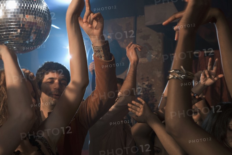 Multi-ethnic people dancing at nightclub