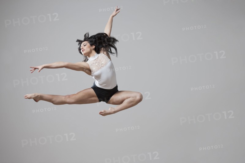 Graceful Caucasian ballet dancer in mid-air