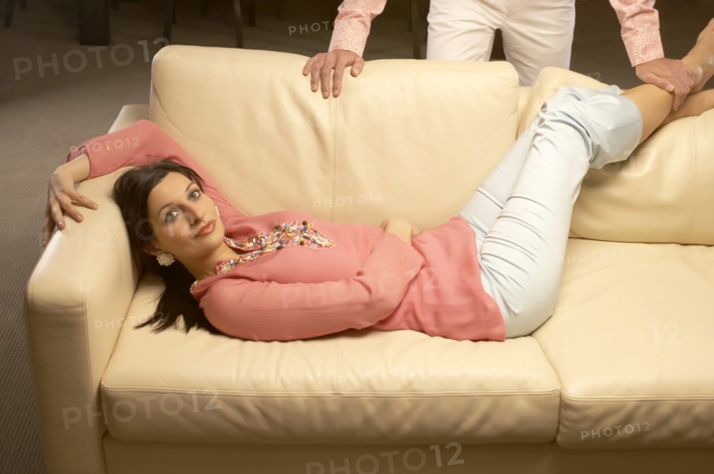 Couple relaxing in living room