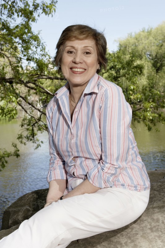 Senior Caucasian woman smiling in park