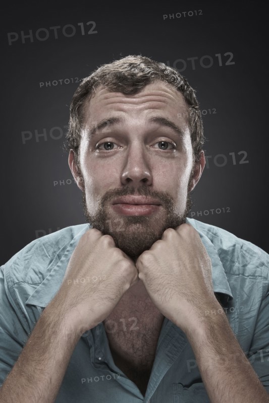 Sad man with hands on chin