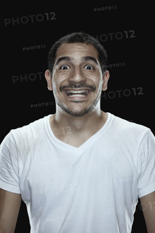 Portrait of excited man smiling