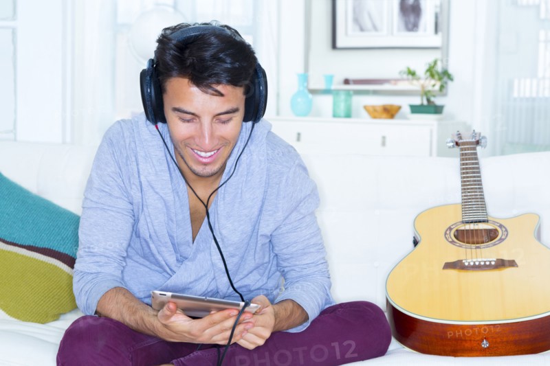Mixed race teenager using digital tablet