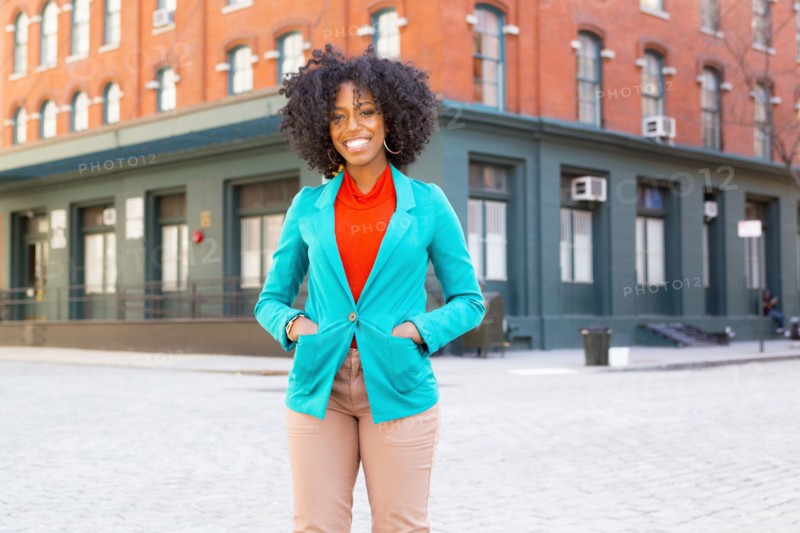 Mixed race woman standing on city street
