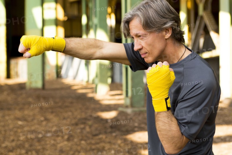Caucasian boxer with fists raised
