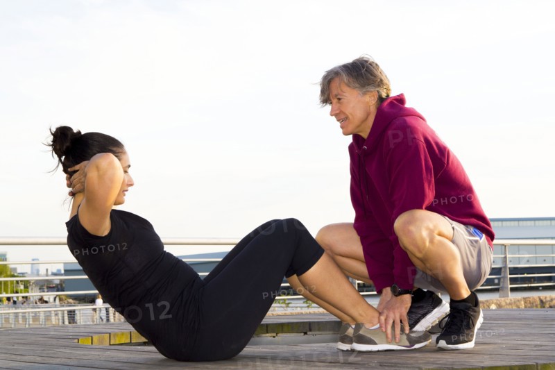 Couple exercising in waterfront park