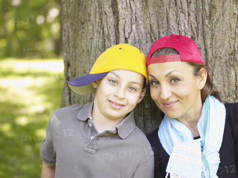Mother and son wearing baseball caps