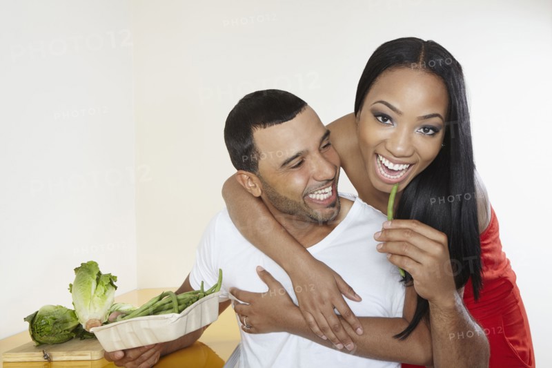 Couple eating vegetables together