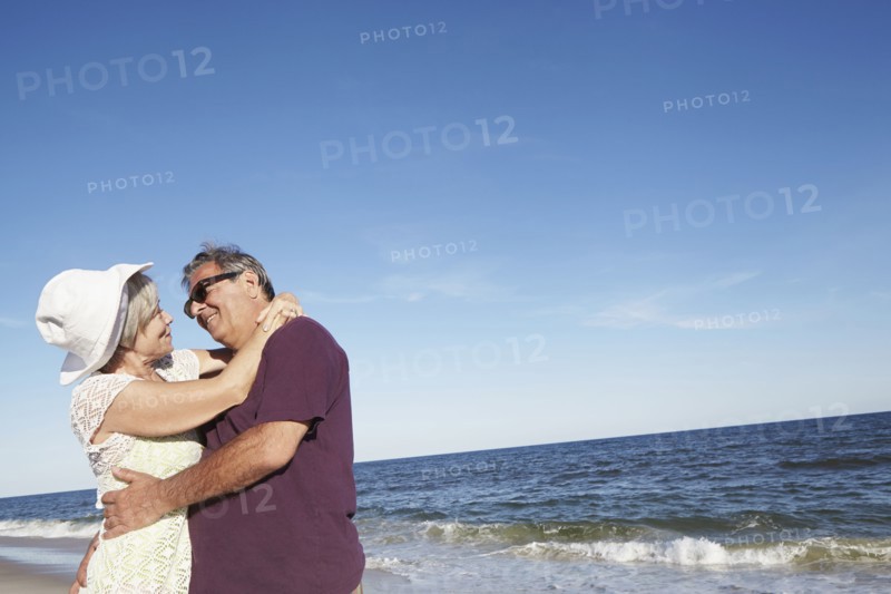 Senior couple dancing on tropical beach