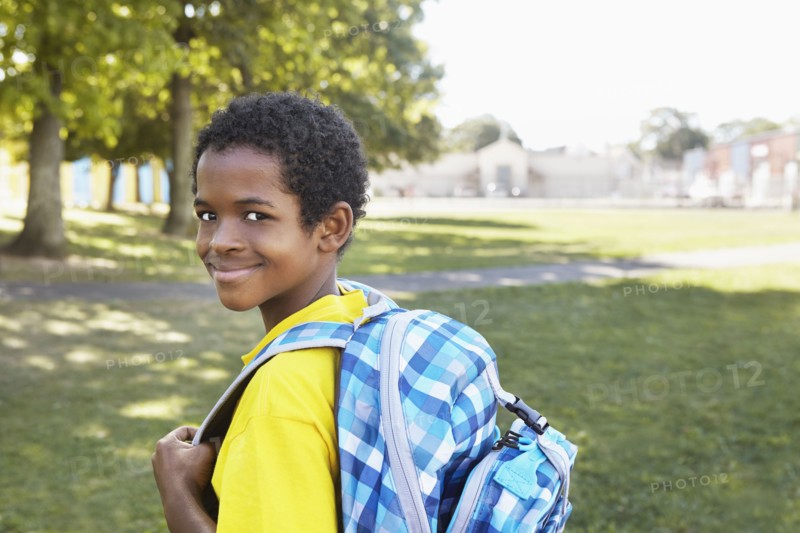 Mixed race boy smiling outdoors