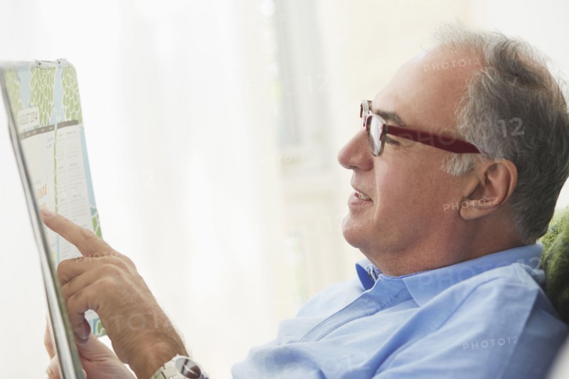 Hispanic man reading map