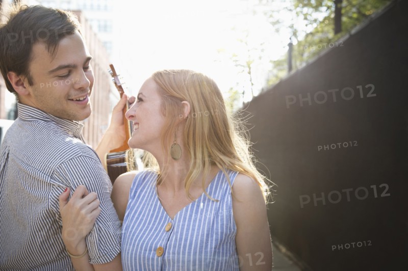Caucasian couple standing in city