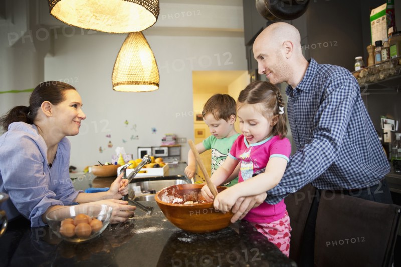 Family cooking in kitchen
