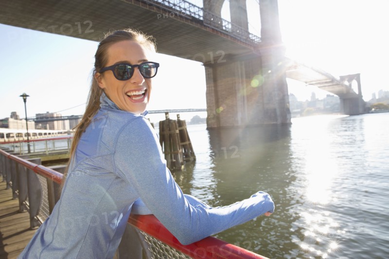 Caucasian woman smiling on waterfront