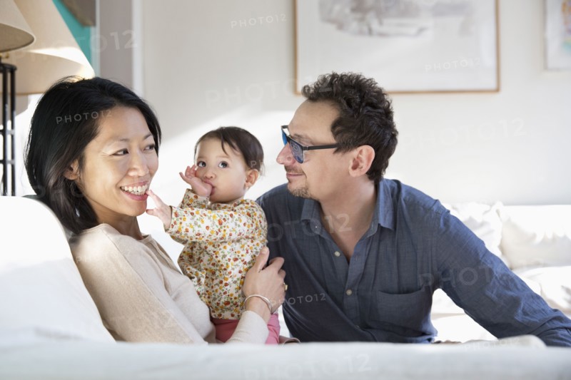 Family relaxing on sofa