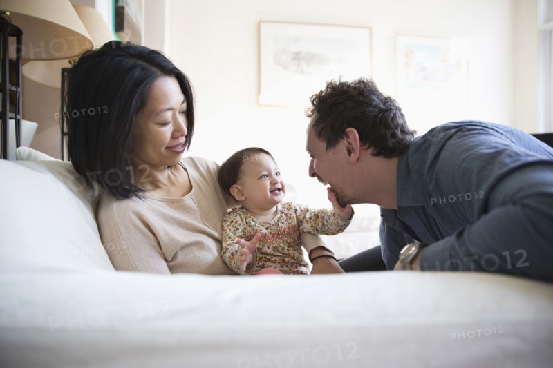 Family playing on sofa