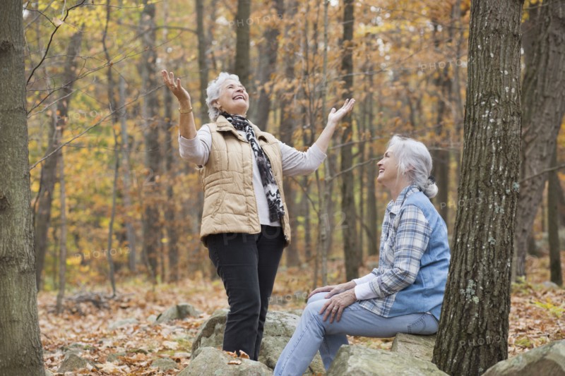 Caucasian women smiling outdoors in autumn