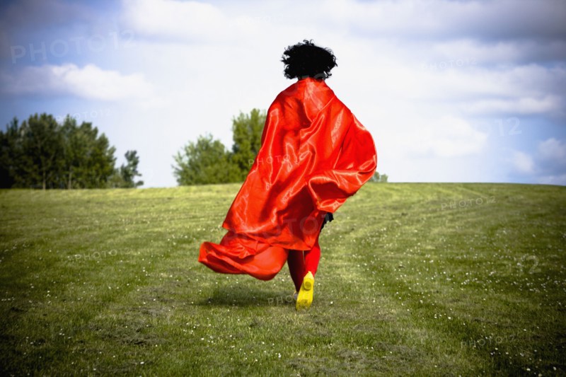 Asian woman running in field