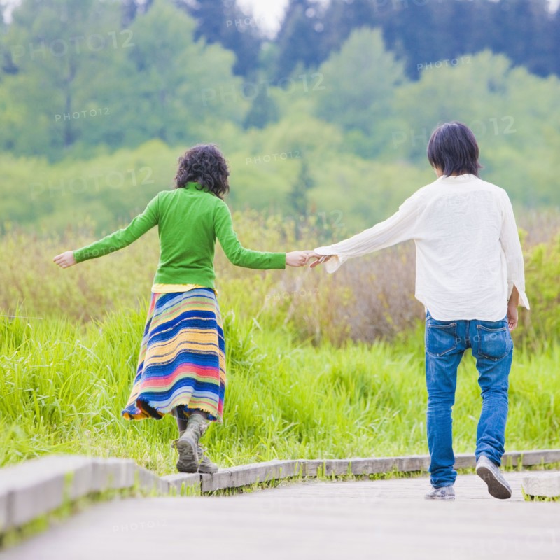 Asian couple holding hands