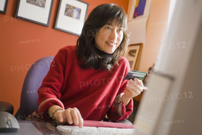 Asian woman shopping online
