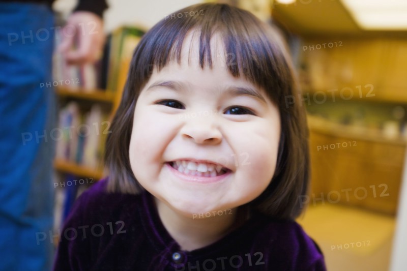 Close up of mixed race girl grinning
