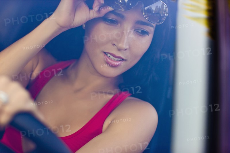 Hispanic woman driving car