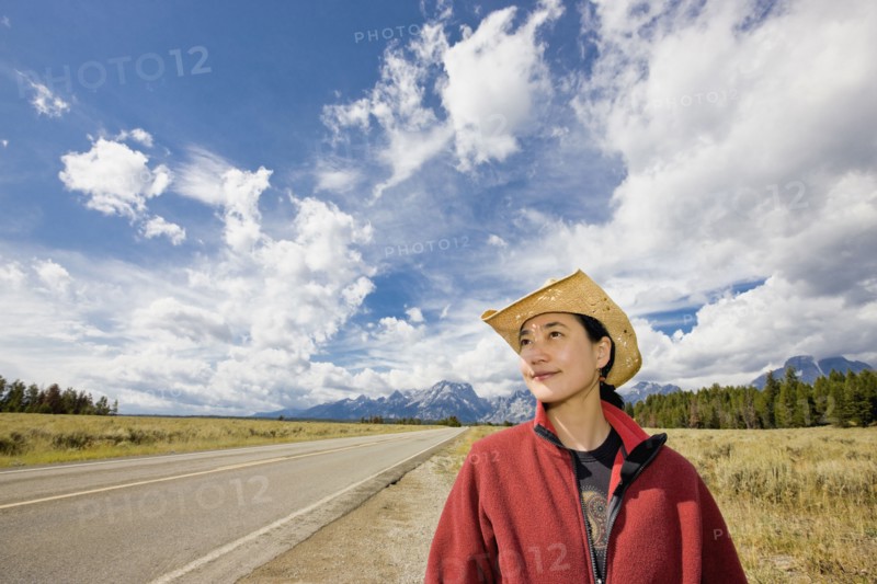 Asian woman on remote highway