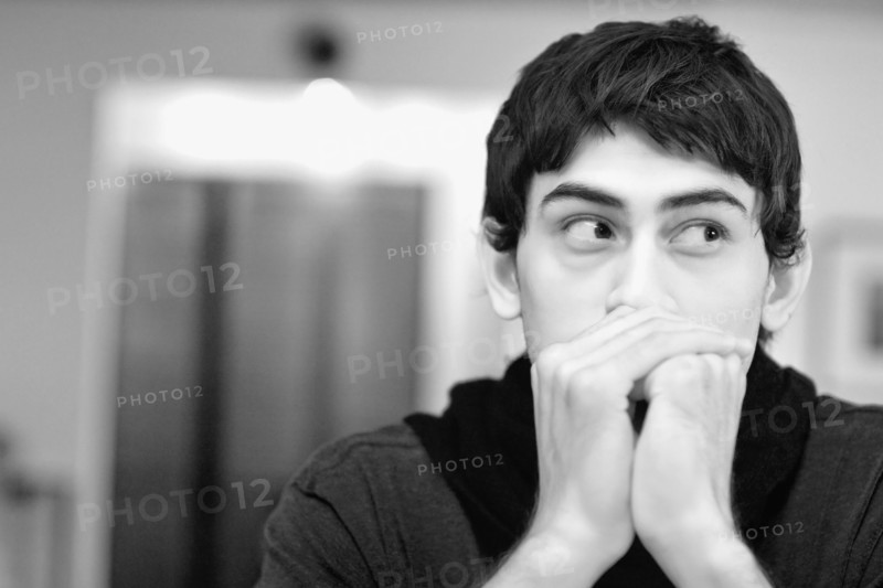 Mixed race man looking anxious