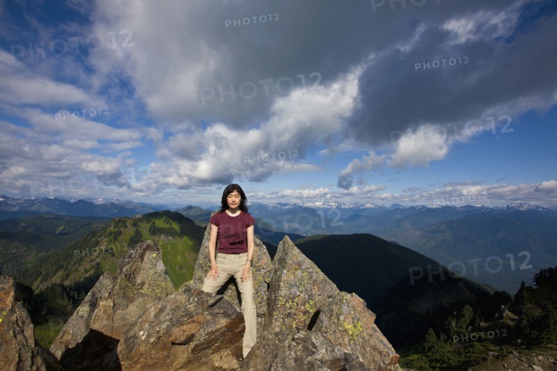 Japanese woman posing on mountain top