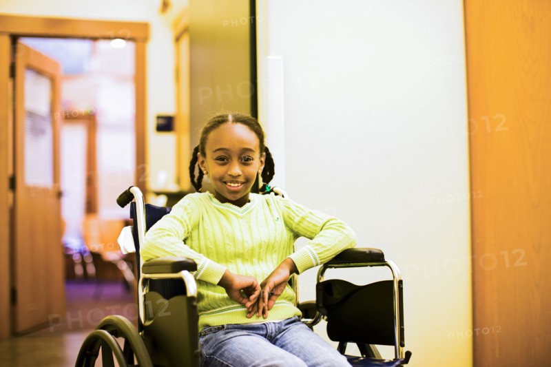 African American girl sitting in wheelchair