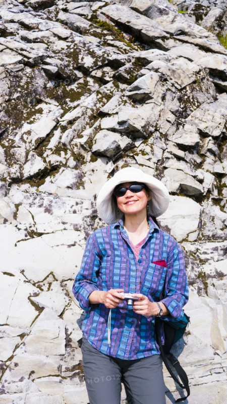 Japanese tourist photographing rock formation