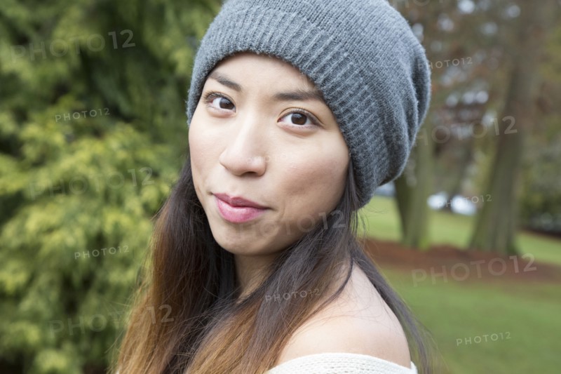 Japanese woman wearing beanie outdoors