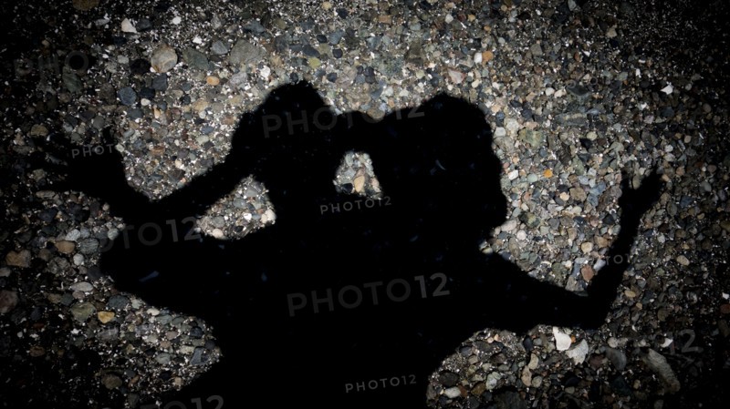 Silhouette of Japanese couple on pavement