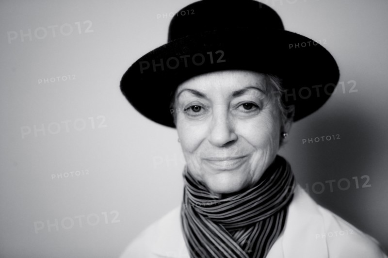 Smiling Caucasian woman wearing scarf and hat
