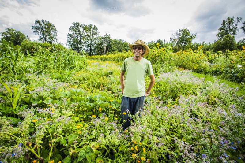 Caucasian farmer wearing cowboy hat in field