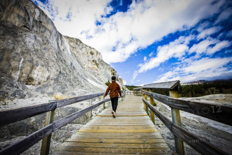 Japanese woman walking on boardwalk