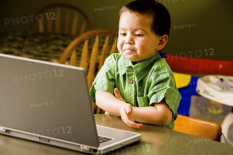 Mixed Race boy using laptop