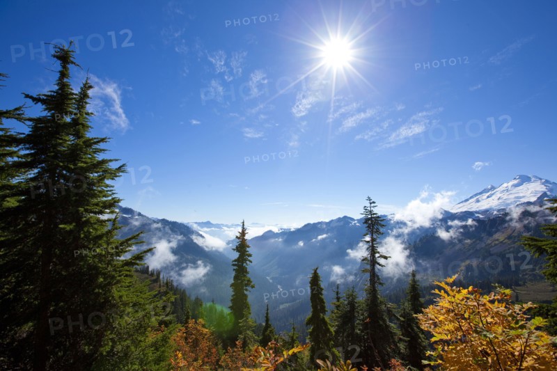 Sun over autumn mountain landscape